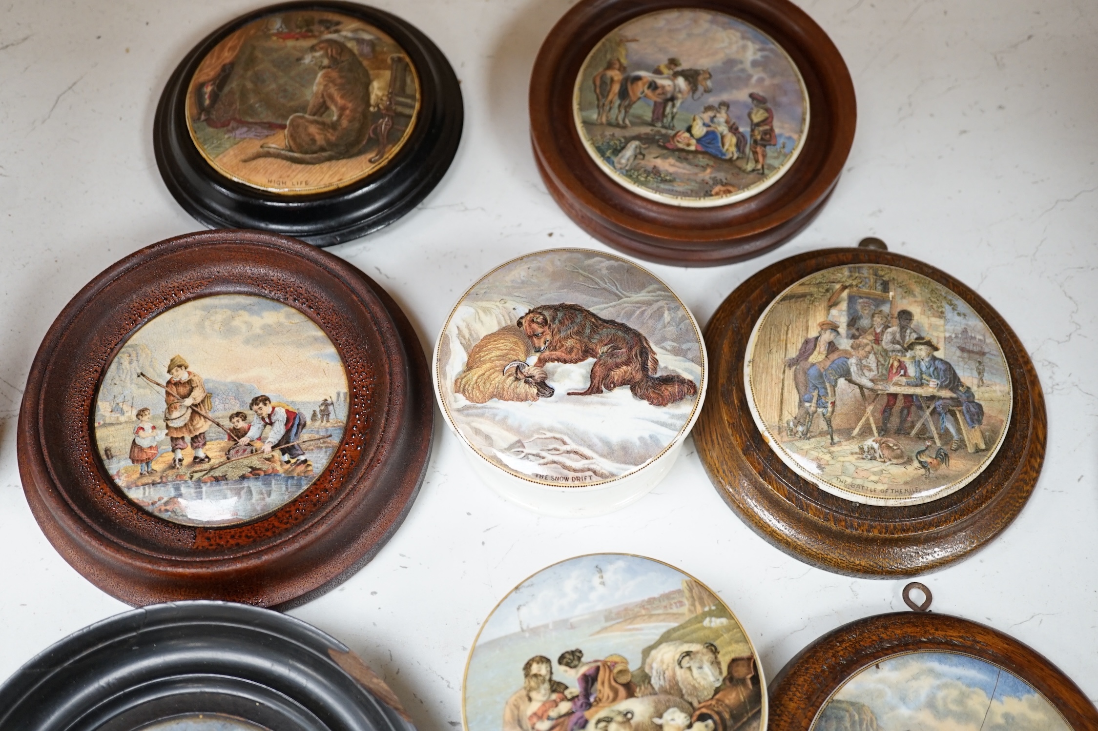 Eleven 19th century mostly framed pot lids including ‘The Snow Drift’, ‘War’, ‘High Life’, etc. Condition - mostly good, one cracked